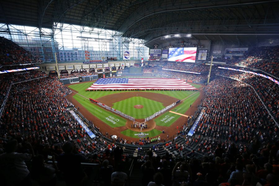 A+large+United+States+flag+covers+the+outfield+at+Minute+Maid+Park+as+Danielle+Bradbery+sings+the+national+anthem+before+the+Houston+Astros+baseball+home-opener+against+the+Los+Angeles+Angels+in+Houston%2C+Monday%2C+April+18%2C+2022.+%28Kevin+M.+Cox%2FThe+Galveston+County+Daily+News+via+AP%29