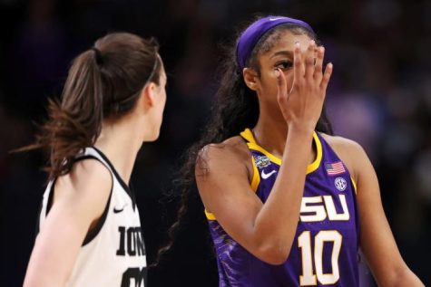 Angel Reese of the LSU Tigers reacts toward Caitlin Clark of the Iowa Hawkeyes during the fourth quarter of the 2023 NCAA Women’s Basketball Tournament championship game.
