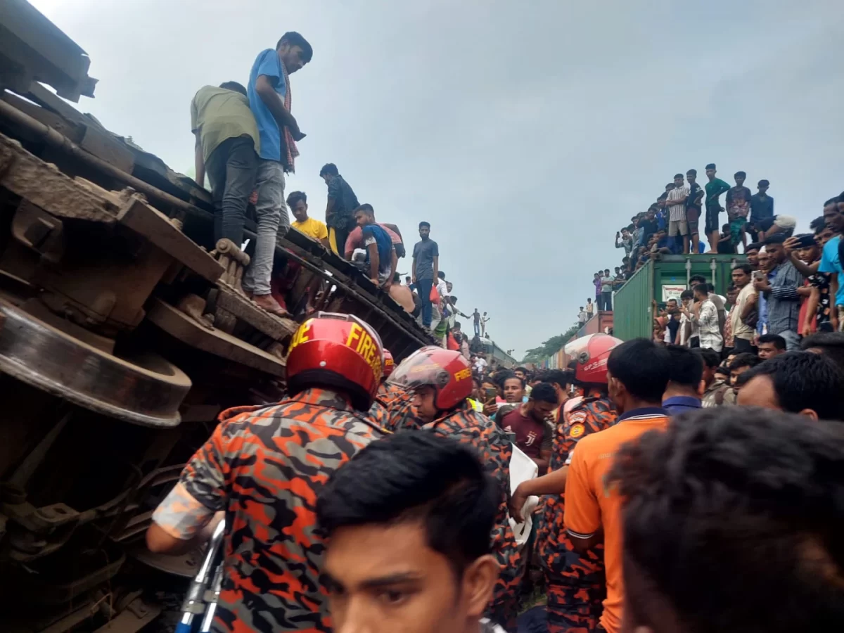 This photograph shows rescuers and locals extracting and aiding the passengers of the trains.  
