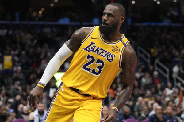 Los Angeles Lakers forward LeBron James reacts after dunking against the Washington Wizards during the second half of an NBA basketball game Thursday, Jan. 30, 2025, in Washington. (AP Photo/Jess Rapfogel)