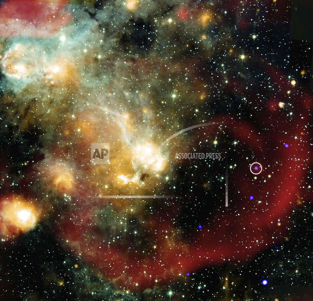 This image provided by NASA shows X-rays from NASA’s Chandra X-ray Observatory (represented in blue) that have been combined with infrared data from NASA’s retired Spitzer Space Telescope (cyan, light blue, teal and orange), and radio from MeerKat (red). An inset shows a more detailed view of the immediate area around this unusual object in X-ray and radio light.)