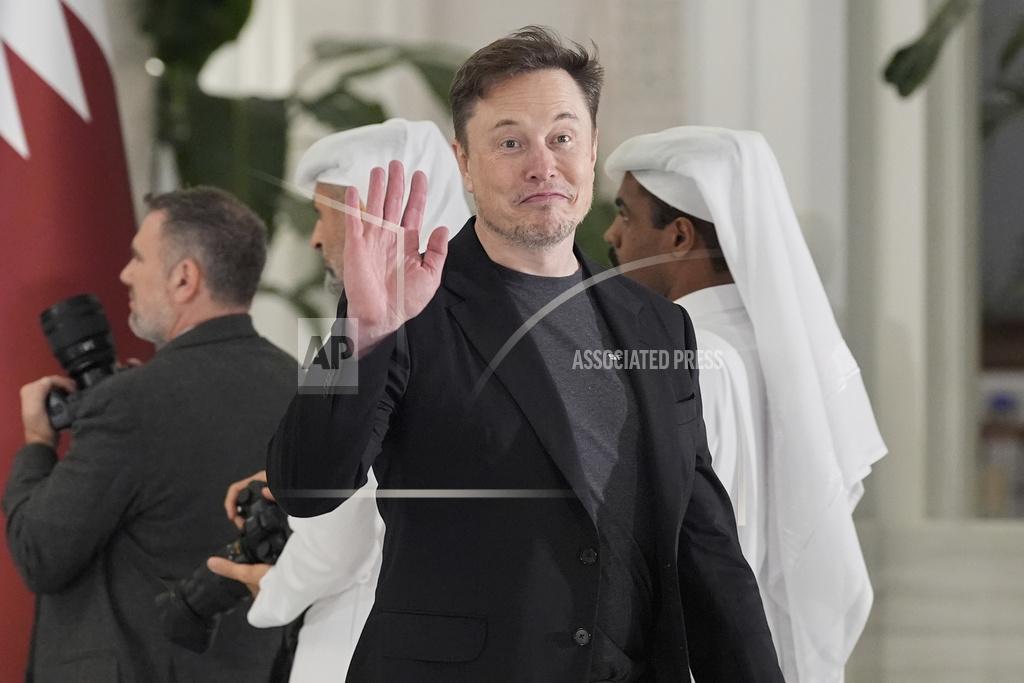 Elon Musk gestures as he arrives for a state dinner hosted by Qatar's Emir Sheikh Tamim bin Hamad Al Thani in honor of President Donald Trump at Lusail Palace in Doha, Qatar, Wednesday, May 14, 2025. 