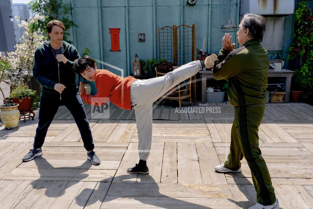 This image released by Sony Pictures shows, from left, Ralph Macchio, Ben Wang and Jackie Chan in a scene from "Karate Kid: Legends."