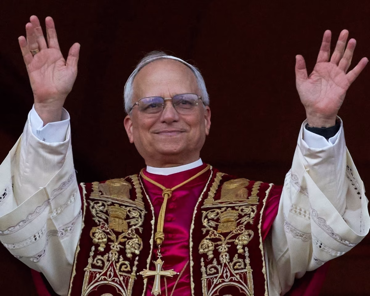 The newly elected Pope Leo XIV greets the Catholic faithful from the balcony of St Peter's Basilica.