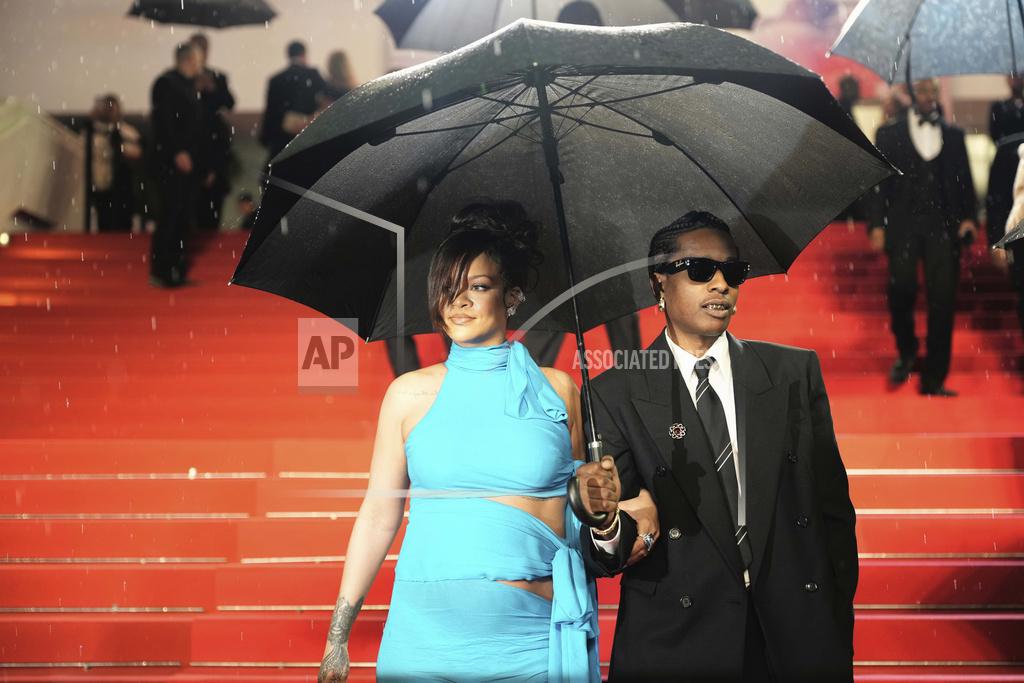 Rihanna, left, and A$AP Rocky pose for photographers upon departure from the premiere of the film 'Highest 2 Lowest' at the 78th international film festival, Cannes, southern France, Monday, May 19, 2025.