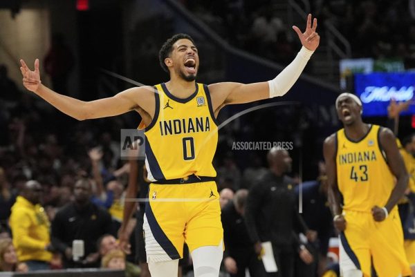 Indiana Pacers guard Tyrese Haliburton, left, celebrates along with forward Pascal Siakam after scoring during the second half in Game 5 of an Eastern Conference semifinal NBA basketball playoff against the Cleveland Cavaliers, Tuesday, May 13, 2025, in Cleveland. 