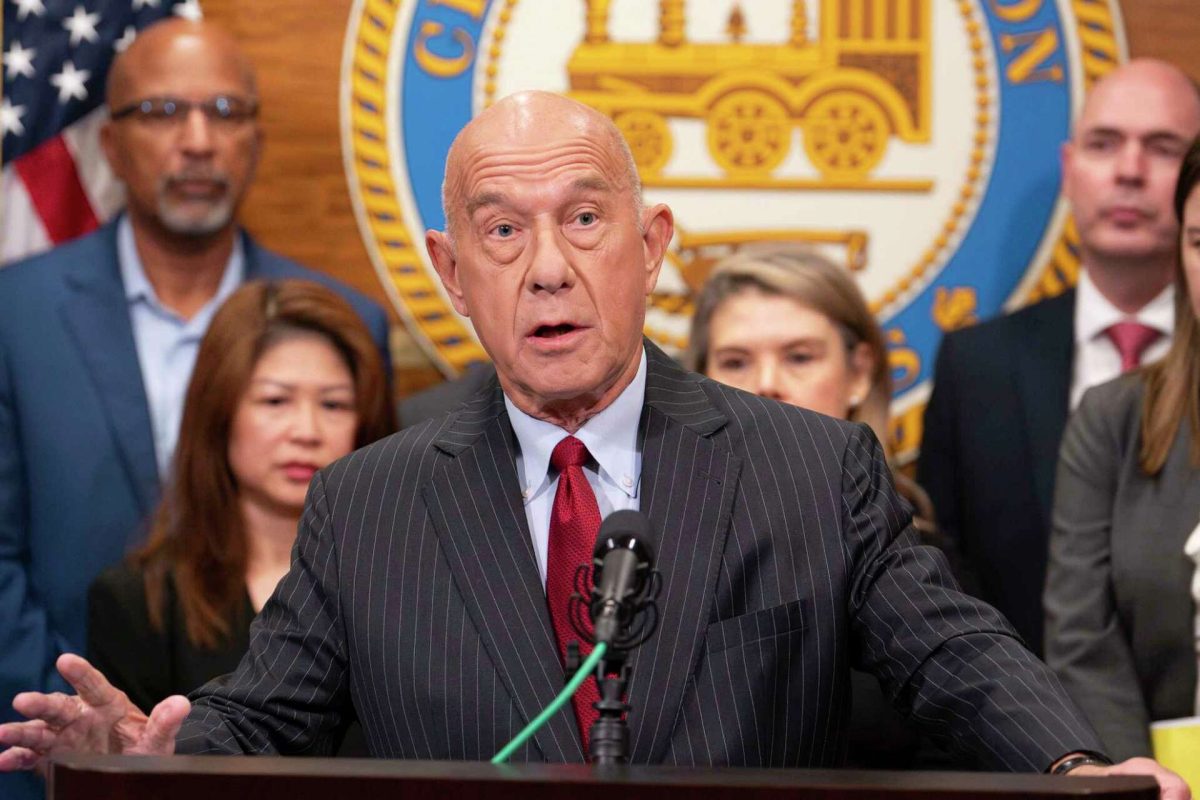 Houston city administrators and elected officials stand with Mayor John Whitmire as he discusses details of his balanced budget during a media briefing in Houston, Tuesday, May 6, 2025.
