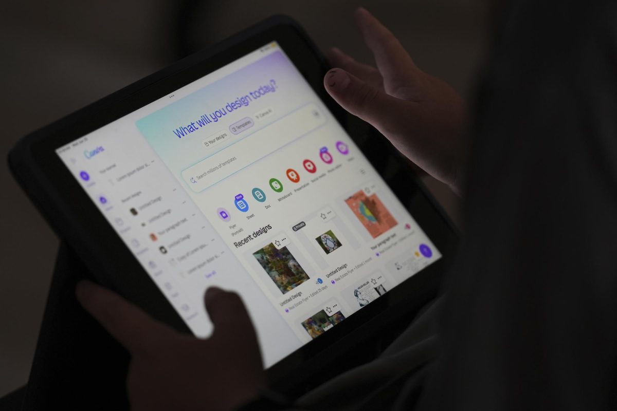 A student is taught how to ask Canva for help during a summer class at Roosevelt Middle School, Wednesday, June 25, 2025, in River Forest, Ill. (AP Photo/Nam Y. Huh)