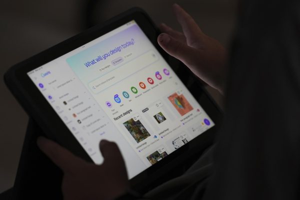 A student is taught how to ask Canva for help during a summer class at Roosevelt Middle School, Wednesday, June 25, 2025, in River Forest, Ill. (AP Photo/Nam Y. Huh)