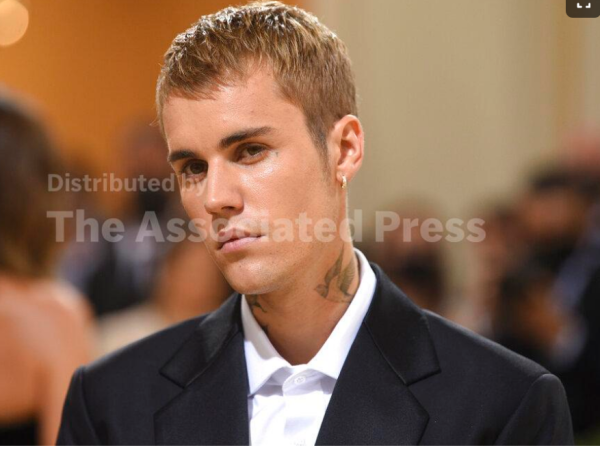 Justin Bieber attends The Metropolitan Museum of Art's Costume Institute benefit gala. Justin Bieber says a rare disorder that paralyzed half of the superstar performer’s face is the reason behind his tour postponement