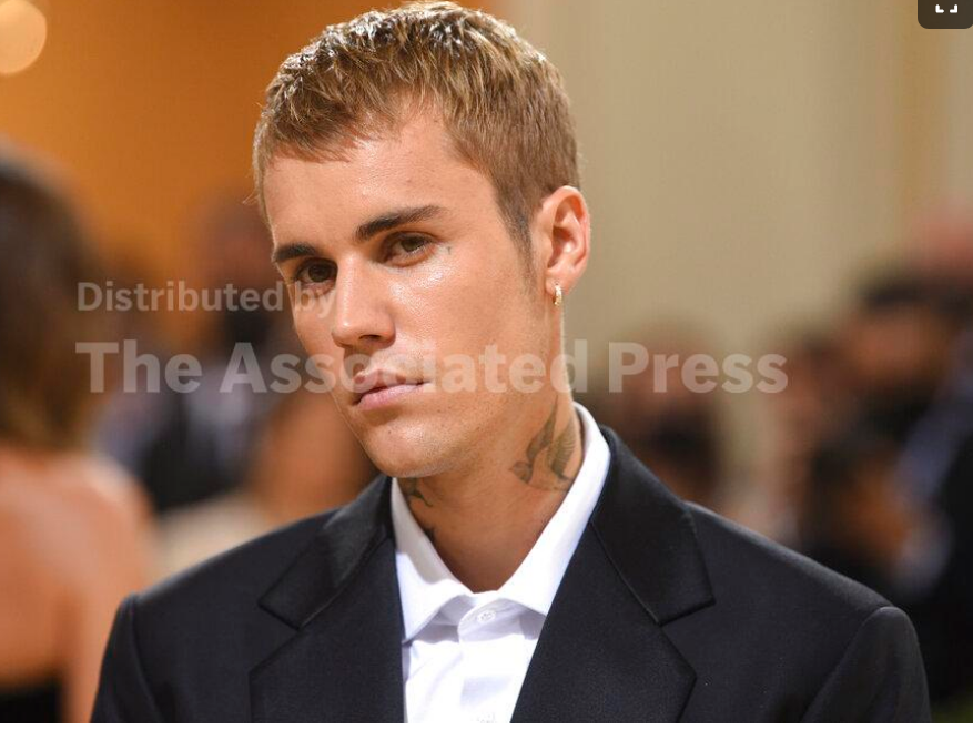 Justin Bieber attends The Metropolitan Museum of Art's Costume Institute benefit gala. Justin Bieber says a rare disorder that paralyzed half of the superstar performer’s face is the reason behind his tour postponement