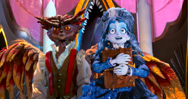 Frankelda holding her notebook while exploring a new world with Herneval as her guide.