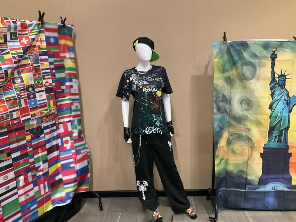 A mannequin adorned for "Voices from Around the World" symbolizes the intersection of culture, identity, and art.