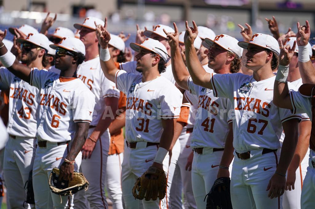 Texas teammates celebrate after an NCAA baseball College World Series elimination game against Alabama, Monday, June 15, 2026 in Omaha, Neb. Texas won 14-2. (AP Photo)