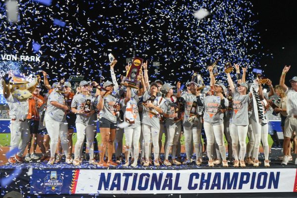 The Texas Longhorns softball team celebrates after defeating Texas Tech 10-4 to win the Women's College World Series championship in Oklahoma City, Friday, June 6, 2025. (AP Photo/Kyle Phillips)