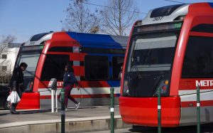 In this Thursday, Jan. 10, 2019 photo, passengers get on and off a METRO Rail Red Line train at Houston Community College Northline Campus in Houston. The Houston Chronicle reports Metropolitan Transit Authority officials are still tweaking the agency’s long-range plan that’s estimated to start with $7.5 billion in improvements for developing 66 miles of bus rapid transit and at least 16 additional miles of light rail.  (Yi-Chin Lee/Houston Chronicle via AP)