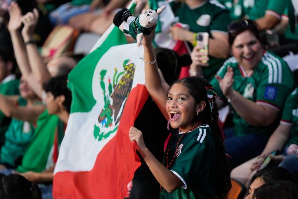 Mexico fans cheer at Shell Energy Stadium, home of the MLS soccer club Houston Dynamo, as they watch a live broadcast in Houston, of a World Cup soccer round of 32 match between Mexico and Ecuador, Tuesday, June 30, 2026. (AP Photo)