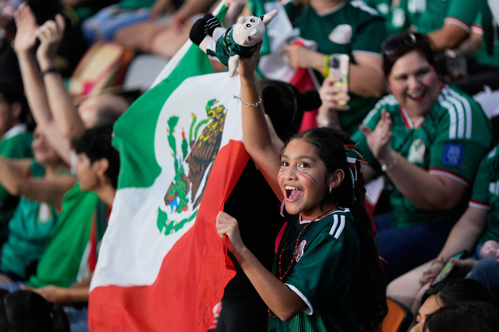 Mexico fans cheer at Shell Energy Stadium, home of the MLS soccer club Houston Dynamo, as they watch a live broadcast in Houston, of a World Cup soccer round of 32 match between Mexico and Ecuador, Tuesday, June 30, 2026. (AP Photo)